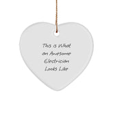 Funny Electrician Gifts, Heart-Shaped Ornament, 'This Is What An Awesome Electrician Looks Like' Quote, Gifts from Men for Electrician, Christmas Unique Gifts for Home - Image 1